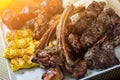 Plate of arabic kebab meat with potato, tomatoes and pita.