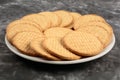 Plate of arrowroot biscuits on a rustic background. Royalty Free Stock Photo