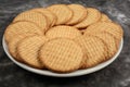 Plate of arrowroot biscuits on a rustic background. Royalty Free Stock Photo
