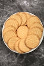 Plate of arrowroot biscuits on a rustic background. Royalty Free Stock Photo