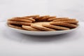 Plate of arrowroot biscuits on a rustic background. Royalty Free Stock Photo