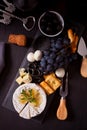Plate with assorted cheese, fruit and other snacks for party Royalty Free Stock Photo