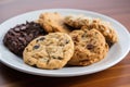 plate of assorted cookies, including chocolate chip, oatmeal raisin and peanut butter