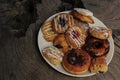 A plate of assorted donuts and pastries