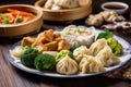 plate of authentic chinese cuisine, with steamed dumplings and stir-fried vegetables