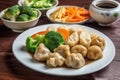 plate of authentic chinese cuisine, with steamed dumplings and stir-fried vegetables