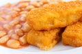 Plate of baked beans with fried fishfingers Royalty Free Stock Photo