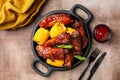 Plate with baked pork ribs with corn cobs, barbecue sauce, rosemary. Royalty Free Stock Photo