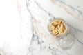 plate with banana slices on marble table, top view. Dried fruit