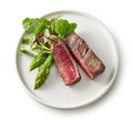 Plate of beef wagyu steak meat with herbs and asparagus Royalty Free Stock Photo