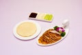 a plate of beijing duck and a plate of pancake