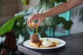 A plate of Belgian waffle with banana and caramel sauce, topped with whipped cream and ice cream Royalty Free Stock Photo