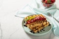 Plate with Belgian waffles with fresh strawberries drenched in chocolate topping