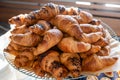 Plate with a big pile of croissants with chocolate flavour