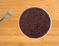 Plate of black beans in a chili sauce with fork Royalty Free Stock Photo