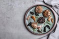 Plate with black garlic on grey table, top view. Space for Royalty Free Stock Photo
