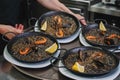 plate of black rice paella with squid, shrimp and mussels Royalty Free Stock Photo