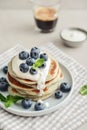 Plate blueberry pancakes with sour cream