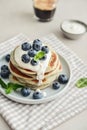 Plate blueberry pancakes with sour cream