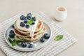 Plate blueberry pancakes with sour cream