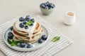 Plate blueberry pancakes with sour cream