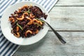 Plate with boiled rice, shrimps and vegetables on light wooden table Royalty Free Stock Photo