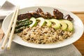 Plate with boiled rice, vegetables and meat on board, closeup Royalty Free Stock Photo