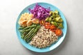 Plate with boiled rice, vegetables and meat on grey background Royalty Free Stock Photo