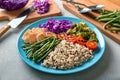 Plate with boiled rice, vegetables and meat on grey background Royalty Free Stock Photo