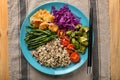 Plate with boiled rice, vegetables and meat on table Royalty Free Stock Photo