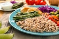 Plate with boiled rice, vegetables and meat on table, closeup Royalty Free Stock Photo