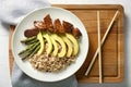 Plate with boiled rice, vegetables and meat on wooden board Royalty Free Stock Photo