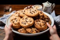 A plate brimming with an assortment of delectable chocolate chip cookies