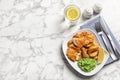 Plate with British traditional fish and potato chips on marble background, top view. Royalty Free Stock Photo