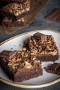 Plate with brownie cakes on a gray wooden table