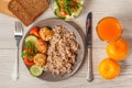 Plate with buckwheat, fried meat cutlets and pieces of fresh cucumber and tomato Royalty Free Stock Photo