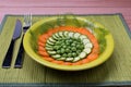 A plate with carrots, zucchini and green peas. Royalty Free Stock Photo