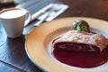 Plate of cherry strudel and cup of coffee Royalty Free Stock Photo