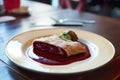 Plate of cherry strudel on a table