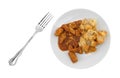 Plate with chicken chunks in barbecue sauce plus potatoes Royalty Free Stock Photo