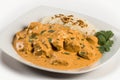 plate of chicken tikka masala, with chunks of tender chicken in creamy and flavorful sauce