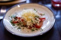 Plate with with chicken, vegetables and grated cheese close up Royalty Free Stock Photo