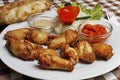 Plate with chicken wings with lepinja and sauces Royalty Free Stock Photo