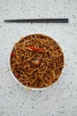 Plate with chicken yakisoba noodles and chopsticks