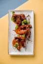 Plate chiken wings teriyaki grill fried sauce mint microgreen pub cuisine