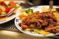 Plate of Chinese fried duck on a burner