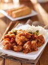 Plate of chinese general tsos chicken with rice and broccoli Royalty Free Stock Photo