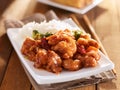 Plate of chinese general tsos chicken with rice and broccoli Royalty Free Stock Photo