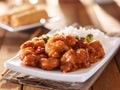 Plate of chinese general tsos chicken with rice and broccoli Royalty Free Stock Photo