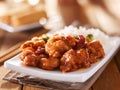 Plate of chinese general tsos chicken with rice and broccoli Royalty Free Stock Photo